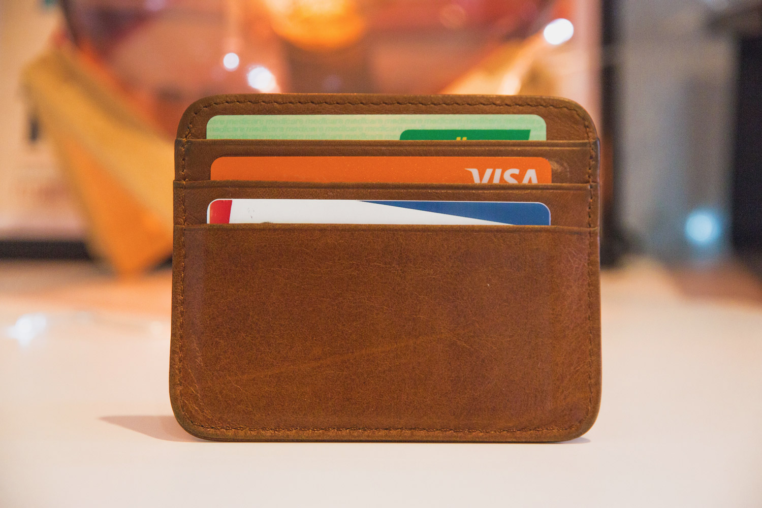 Brown wallet showing bank cards